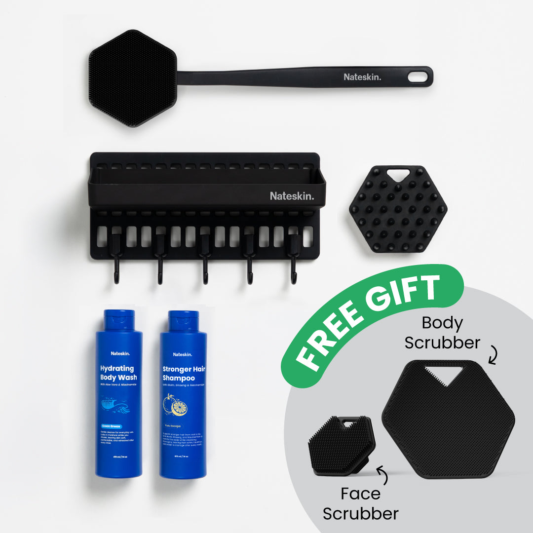Set of black Nateskin grooming tools with blue bottles labelled Hydrating Body Wash and Stronger Hair Shampoo on a white background